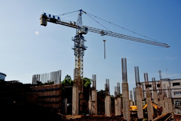 a-construction-site-with-a-crane-in-the-background.jpg a construction site with a crane in the background